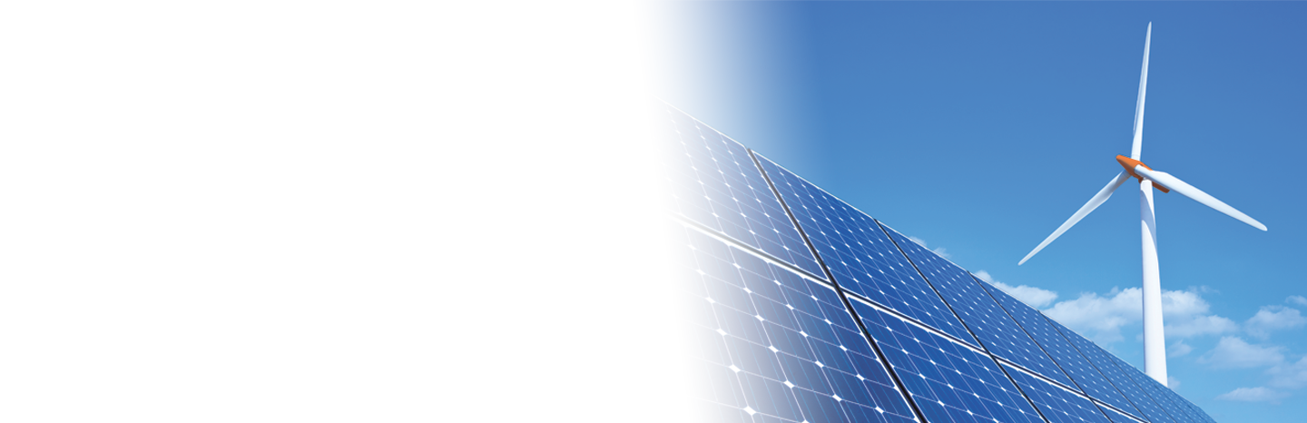 Solar panels and wind turbine against blue sky